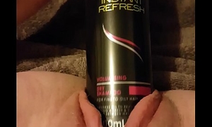 Young floozy fucks gaping twat with 6.3"_ on touching hairspray can